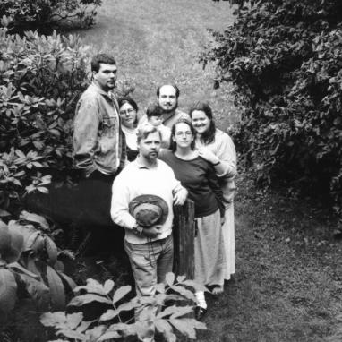 black and white image of five adults and a baby